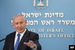 Israel's Prime Minister Benjamin Netanyahu announces full diplomatic ties will be established with the United Arab Emirates, during a news conference on Thursday, Aug. 13, 2020 in Jerusalem.