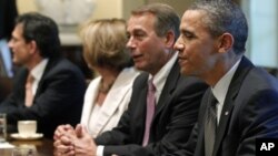 President Barack Obama sits with House Speaker John Boehner of Ohio, House Minority Leader Nancy Pelosi of California, House Majority Leader Eric Cantor of Virginia, as he meets with Republican and Democratic leaders regarding the debt ceiling in the Cabi