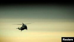 President Donald Trump arrives aboard the Marine One to greet the remains of a U.S. military commando killed during a raid on the al Qaeda militant group in southern Yemen on Sunday, at Dover Air Force Base, Dover, Delaware, Feb. 1, 2017.