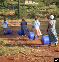 Villagers in Kgautswane, South Africa, head to the river with their new hippo rollers.