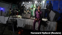 Conglese rumba singer Manda Chante, leader of the music group Bana, is pictured with his musicians at La Septante club in the Kasa-Vubu neighborhood in Kinshasa, Democratic Republic of Congo September 24, 2021. (REUTERS/Hereward Holland)