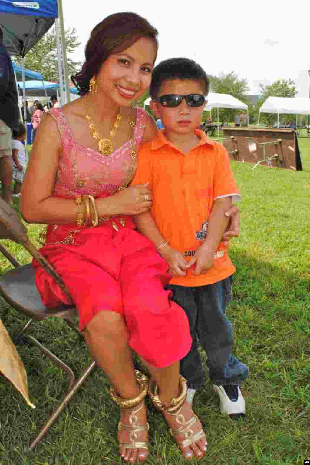 Darath Ly, dressed in Cambodian wedding costume, and her four-year-old son, Aaron Ly.