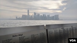 The names of 775,000 immigrants are memorialized across 770 panels that form the American Immigrant Wall of Honor, facing New York’s Lower Manhattan skyline. (R. Taylor/VOA)