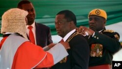 FILE: Zimbabwean President Emmerson Mnangagwa during his inauguration ceremony at the National Sports Stadium in Harare, Sunday, Aug. 26, 2018. 