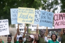 Protesters march to demand action on climate change, on the streets in Lagos, Nigeria, Sept. 20, 2019.