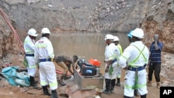 FILE - Mine workers are seen during a rescue mission in Chingola, around 400 kilometers (248 miles) north of the capital Lusaka, Zambia, December 2, 2023.