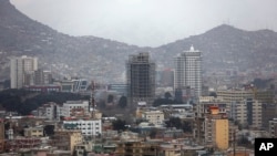 FILE - Construction projects can be seen in Kabul, Afghanistan, March 27, 2019. The U.S. has cut more than $160 million in aid for Afghanistan to motivate the government to be more accountable to its citizens and to the global community.