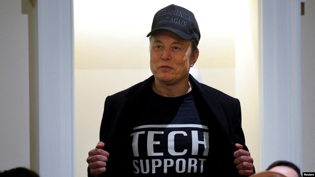 Elon Musk shows off his t-shirt reading "Tech Support" while speaking at the first cabinet meeting hosted by U.S. President Donald Trump, at the White House in Washington, Feb. 26, 2025. 