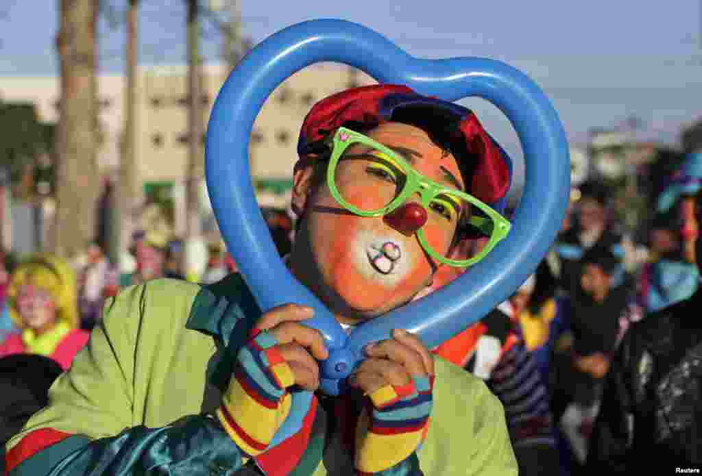 A Salvadorean clown going by the name of &quot;Bobo&quot; poses during National Clown Day celebrations at Beethoven Square in San Salvador, El Salvador, Dec. 3, 2014.