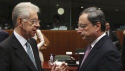 Italy's Prime Minister, Mario Monti,left, talks with President of the European Central Bank Mario Draghi, before a meeting of EU finance ministers in Brussels.