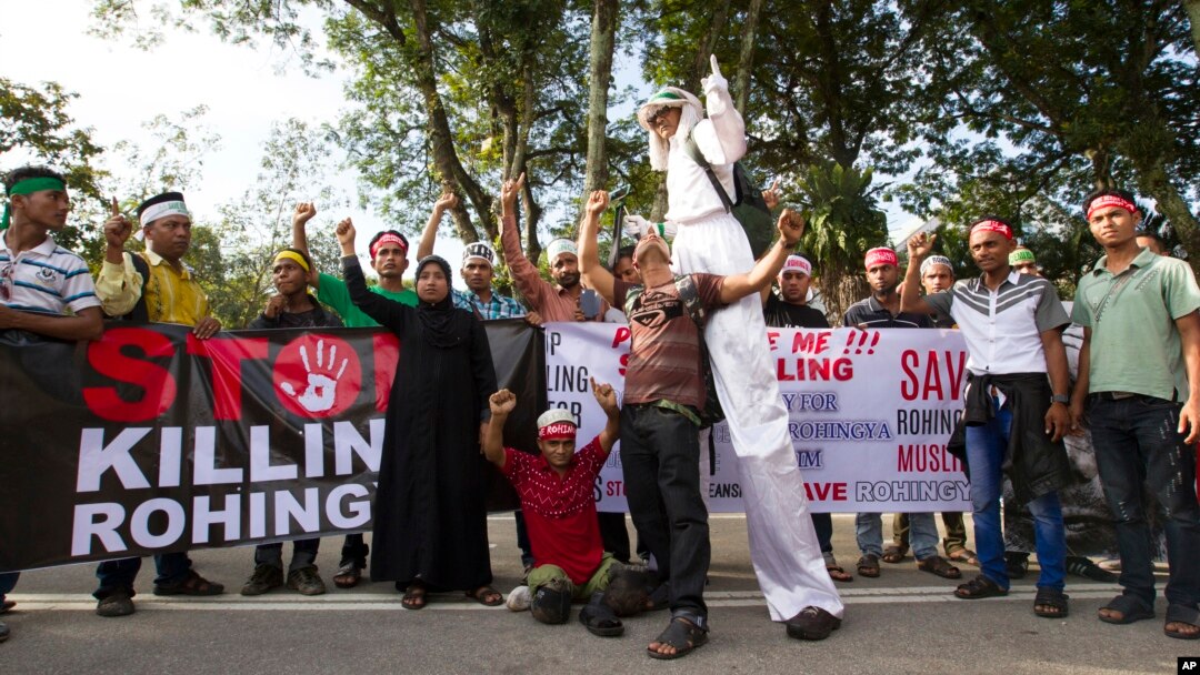 Myanmar ethnic Rohingya Muslims shout slogans during a protest against the persecution of Rohingya Muslims in Myanmar, in Kuala Lumpur, Malaysia, Sunday, Dec. 4, 2016. 