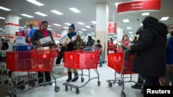 People shop inside a Target store during Black Friday sales in Brooklyn, New York, Nov. 29, 2013.