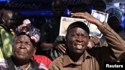 Sarah Hussein Obama (L), grandmother to President Obama and his uncle Said Obama attend a news conference to celebrates his re-election in his ancestral home village of Nyangoma Kogelo, Kenya, November 7, 2012. 
