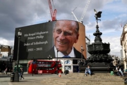 A tribute to Britain's Prince Philip is projected onto a large screen at Piccadilly Circus in London, after the announcement of the duke's death.