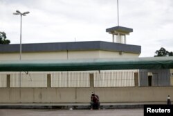 A relative of a prisoner is seen in front of Anisio Jobim prison in Manaus, Brazil, Jan. 3, 2017.