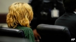 Colt Gray, charged as an adult with four counts of murder, sits in the Barrow County courthouse during his first appearance for the Wednesday shooting at Apalachee High School, in Winder, Georgia, Sept. 6, 2024.