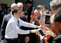 U.S. Democratic presidential candidate Mayor Pete Buttigieg shakes hands with supporters after delivering remarks on foreign policy and national security in Bloomington, Indiana, June 11, 2019.
