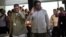 Ivan Marquez, right, and Ricardo Tellez, members of the negotiation team for Colombia's Revolutionary Armed Forces of Colombia, or FARC, wave as they arrive for peace talks in Havana, Cuba, Monday, Nov. 19, 2012.