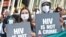 Activists display placards during a rally at the AIDS Conference 2014 at the Melbourne Convention and Exhibition Centre (MCEC) in Melbourne, on July 22, 2014. 