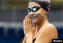 Syrian refugee team swimmer Yusra Mardini, 18, from Syria practices at the Olympic swimming venue.
