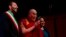 Tibetan spiritual leader the Dalai Lama (C), flanked on left by Rome's Mayor Ignazio Marino, arrives at the opening of the World Summit of Nobel Peace Laureates in Rome, Dec. 12, 2014.