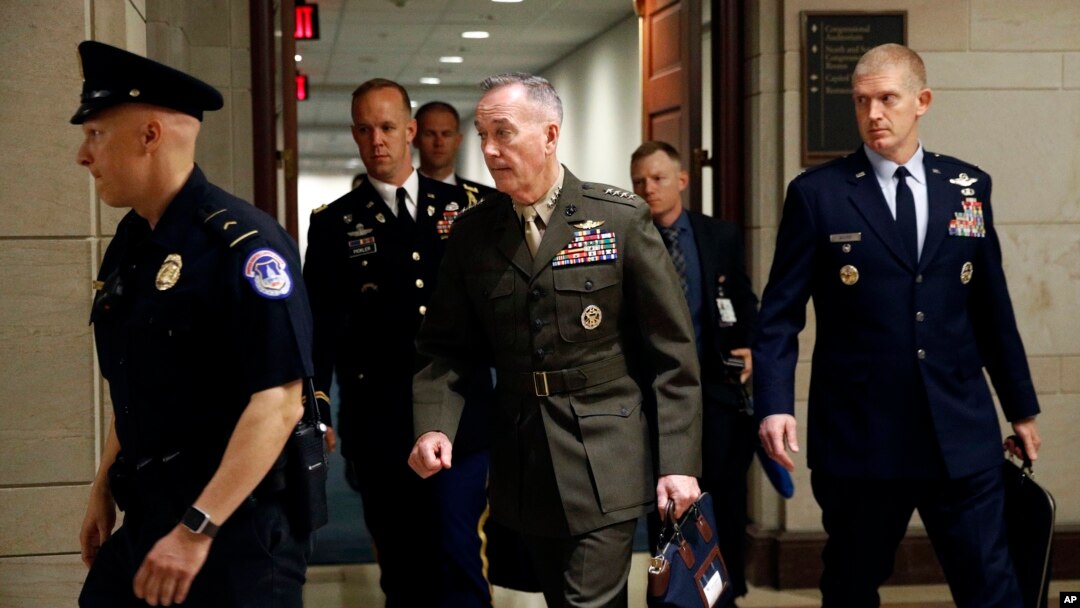 Joint Chiefs Chairman Gen. Joseph Dunford, center, walks to a classified briefing for members of the U.S. Senate on Iran, on Capitol Hill in Washington, May 21, 2019. 