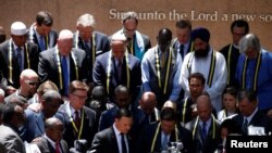 Interfaith leaders take part in a prayer vigil in a park following the multiple police shooting in Dallas, Texas, July 8, 2016. 