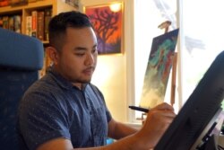 Kwanchai Moriya, a Thai-Japanese boardgame illustrator, at his studio in Monrovia, CA