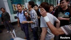 A man shares his opposing views with pro-democracy student protesters in the Mong Kok district of Hong Kong, Oct. 18, 2014. 