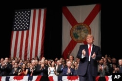 FILE - President Donald Trump arrives in Miami to speak about Cuba policy, June 16, 2017.