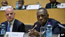 Issa Hayatou, right, speaks as FIFA President Gianni Infantino, left, listens, at the opening of the general assembly of the Confederation of African Football (CAF) in Addis Ababa, Ethiopia, March 16, 2017. 