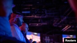 Saudi Crown Prince Mohammed bin Salman attends the Red Sea WBA, WBO and IBF heavyweight world title boxing fight, in King Abdullah Sports City Arena, Jeddah. (Bandar Algaloud/Courtesy of Saudi Royal Court/Handout via Reuters)