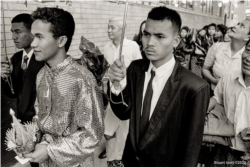 Ricky, the groom, during a Cambodian traditional wedding ceremony in Uptown, Chicago, 1990s.