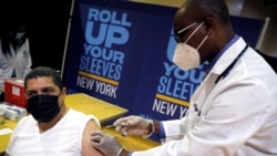 FILE - The Pfizer vaccine is given amid the coronavirus disease (COVID-19) pandemic, in the Harlem section of Manhattan in New York City, New York, April 23, 2021.