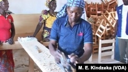 A Nigerian refugee carpenter at Minawao workshop.