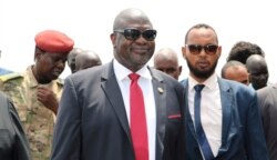 FILE - In this Oct. 19, 2019 file photo, South Sudan's opposition leader Riek Machar, center, returns to the country, in Juba, South Sudan.