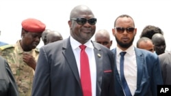 FILE - Riek Machar, center, now his country's first vice president, is pictured in Juba upon his return to South Sudan on Oct. 19, 2019.