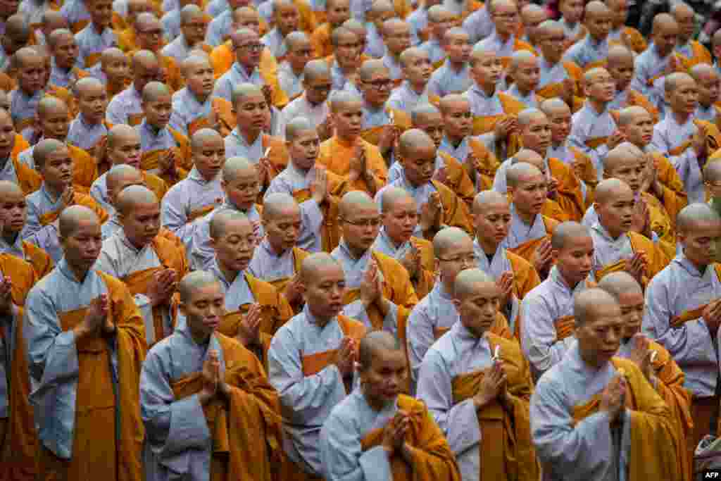 Buddhist monks pray for late Vietnam&#39;s President Tran Dai Quang at the Viet Nam Quoc Tu Pagoda in Ho Chi Minh City. Quang, a former police chief known as a tough politician and committed communist with little tolerance for dissent, died on September 21 aged 61 after a serious illness, state media reported.