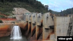 FILE - This image from video shows a dam on the Mekong River in Laos.