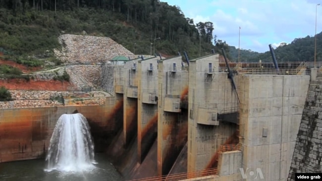 FILE - This image from video shows a dam on the Mekong River in Laos.