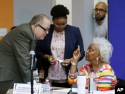 Brenda Snipes, Broward County supervisor of elections, right, speaks with officials before a canvassing board meeting Nov. 9, 2018, in Lauderhill, Fla. Florida will learn Saturday afternoon whether there will be recounts in the U.S. Senate race between Republican Gov. Rick Scott and incumbent Democrat Bill Nelson; and in the governor’s race between former Republican U.S. Rep. Ron DeSantis and the Democratic mayor of Tallahassee, Andrew Gillum.