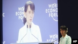 Burma's opposition leader Aung San Suu Kyi addresses the World Economic Forum on East Asia in Bangkok, Thailand, Friday, June 1, 2012.