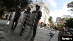 Members of security forces stand guard outside the National Assembly in Caracas, Venezuela, May 7, 2019.