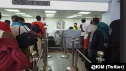 FILE - Ethiopian migrants depart Aden Airport as part of IOM's Voluntary Humanitarian Return initiative, May 22, 2019.