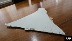 This file photo taken on March 3, 2016 shows a piece of suspected aircraft wreckage found off the east African coast of Mozambique at Mozambique's Civil Aviation Institute (IACM) in Maputo.