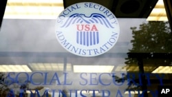 FILE - Signage for a local Social Security Administration office is seen in Mount Prospect, Illinois, Oct. 12, 2022.