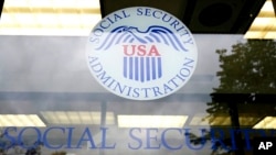 FILE - Signage for a local Social Security Administration office is seen in Mount Prospect, Illinois, Oct. 12, 2022.