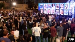 Survivors, friends and relatives attend a memorial for the victims killed at or kidnapped from the Supernova music festival during the October 7 attacks by Palestinian militants, on the eve of the attacks' first anniversary in Tel Aviv on October 6, 2024.