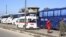 Syrian civilians in buses leave the Waer neighborhood, in the city of Homs, Syria, as part of a deal with local government forces in which dozens of of insurgents are also being allowed safe passage to areas in the country's north, Dec. 9, 2015.
