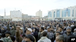 Libyan protesters take part in a demonstration in the seaport city of Tobruk, February 20, 2011